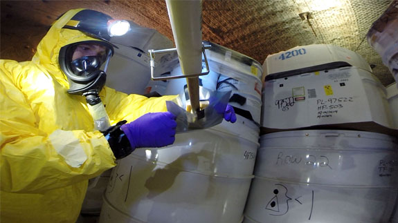 WIPP recovery team getting samples from the damaged drum following the incident. Image: US Department of Energy